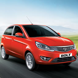 Tata Bolt hatchback taxi parked at RR Tours and Travels Madurai